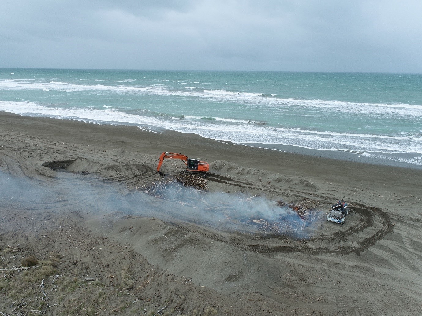 Tikapa Beach wood burn by drone 2024